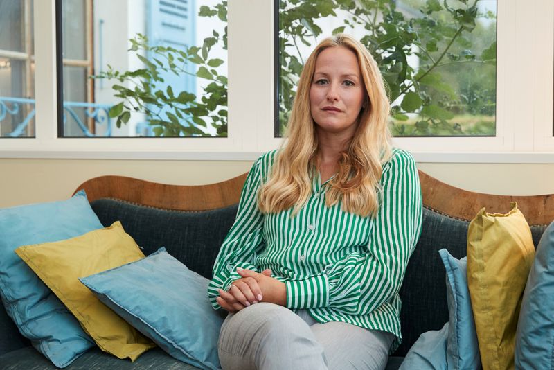 © Reuters. Brostrom former policy adviser at UNAIDS poses at her house in Divonne-les-Bains