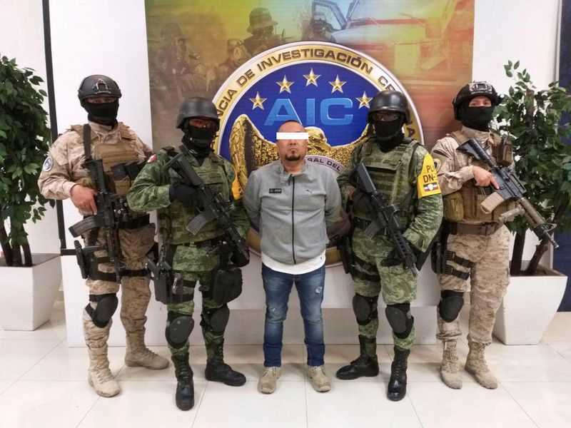 &copy; Reuters. Members of the federal forces flank Jose Antonio Yepez in Guanajuato