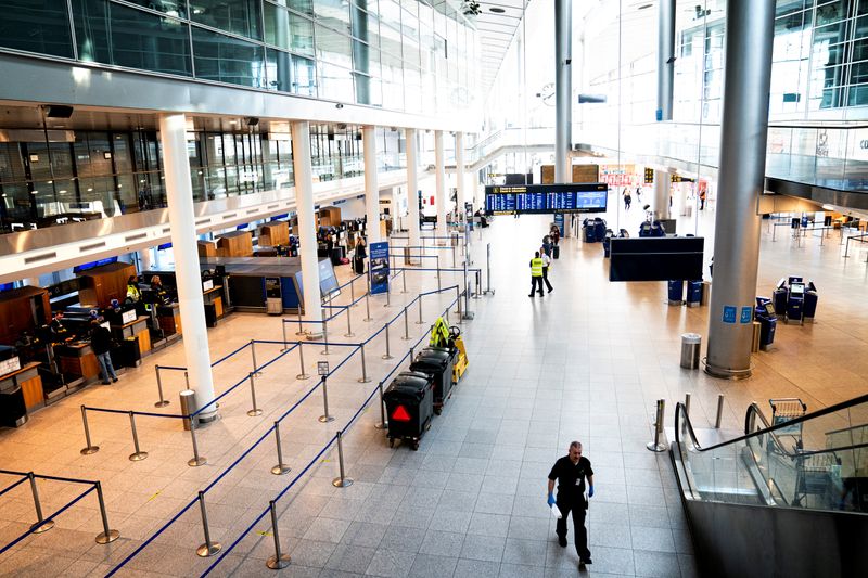&copy; Reuters. Copenhagen Airport&apos;s Terminal 3 hall is seen almost empty following the outbreak of the coronavirus disease (COVID-19) after the country lockdown in Copenhagen