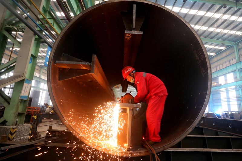 © Reuters. Man works at a production base of CSCEC Steel in Meishan