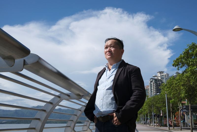 &copy; Reuters. Ricky Wong Wai-hung, Pastor-in-charge of Trinity Theological Baptist Church, poses after interview with Reuters in Hong Kong