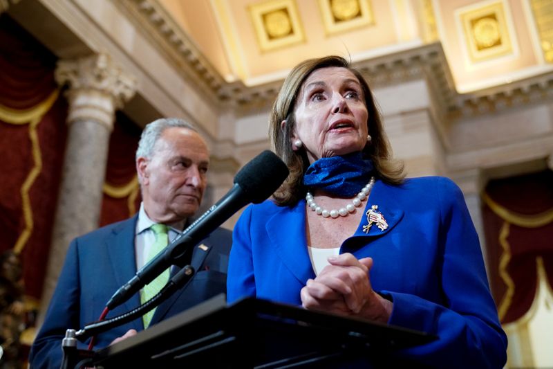 &copy; Reuters. U.S. Speaker of the House Pelosi, joined by Senate Minority Leader Schumer, speaks to reporters in the U.S. Capitol in Washington
