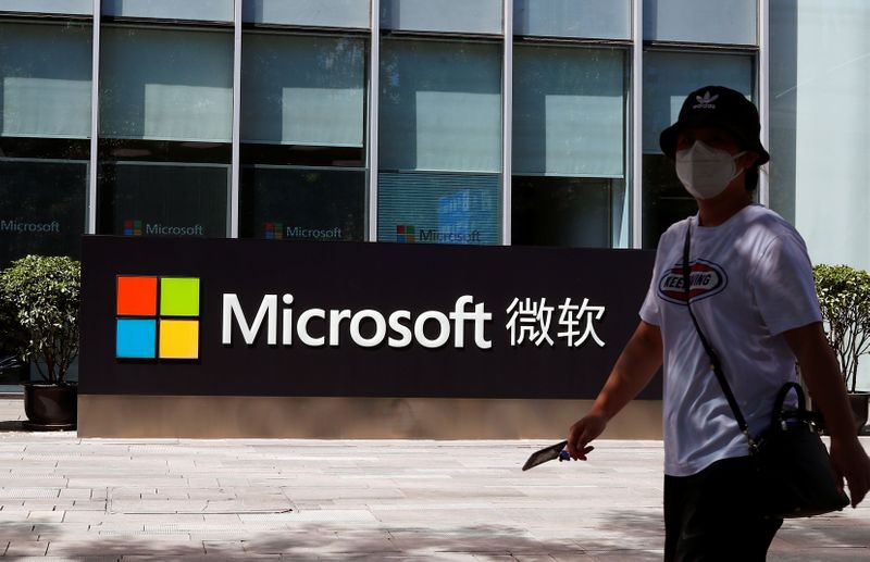 &copy; Reuters. A person walks past a Microsoft logo at the Microsoft office in Beijing