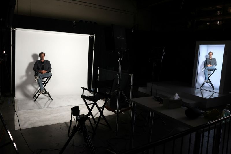 &copy; Reuters. Portl inventor David Nussbaum is shown with an A.I.-powered life-size hologram of himself in Gardena