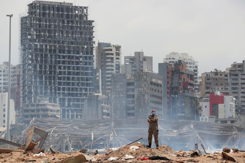 &copy; Reuters. FILE PHOTO: A soldier stands at the devastated site of the explosion at the port of Beirut