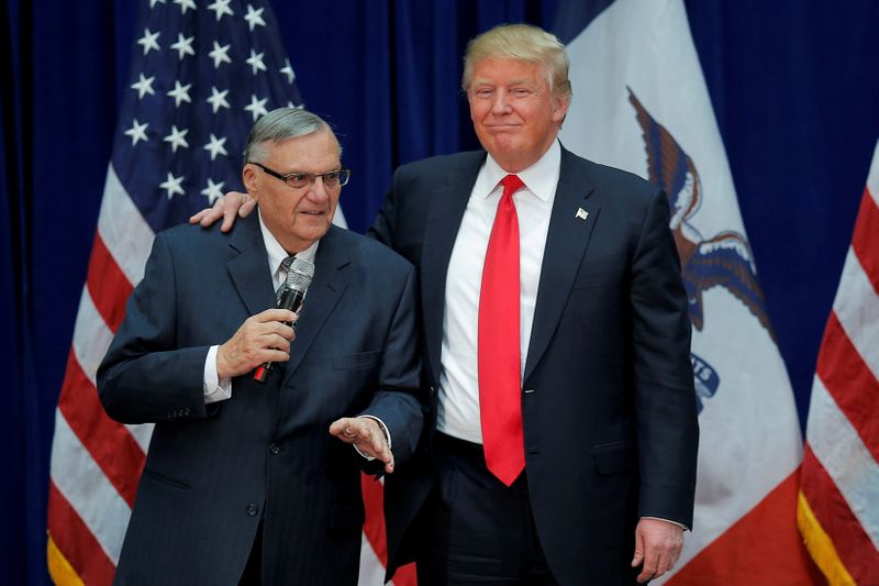 &copy; Reuters. FILE PHOTO: FILE PHOTO: U.S. Republican presidential candidate Donald Trump is joined onstage by Maricopa County Sheriff Joe Arpaio at a campaign rally in Marshalltown