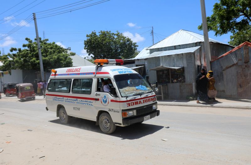 © Reuters. Ambulance is seen near blast site in Mogadishu