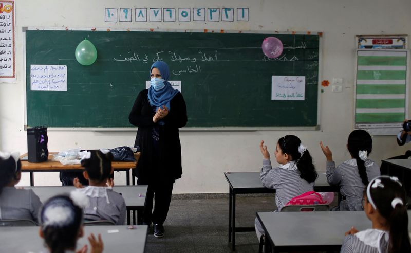 &copy; Reuters. Gaza students begin new school year amid COVID-19 concerns