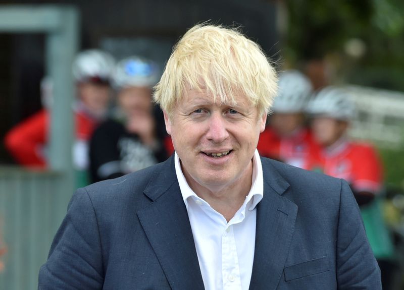 &copy; Reuters. FILE PHOTO: British Prime Minister Boris Johnson speaks to local people at a heritage centre in Beeston near Nottingham, England
