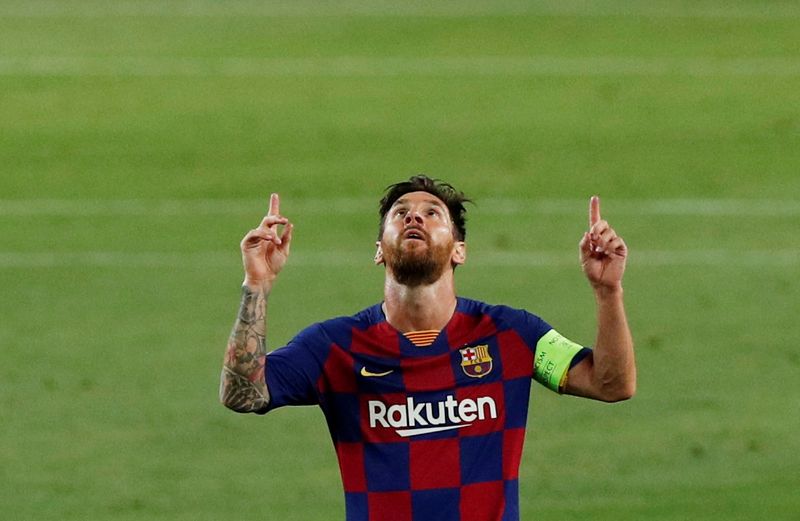 &copy; Reuters. Lionel Messi, del Barcelona, festeja un gol en el partido contra el Nápoli por la Champions League