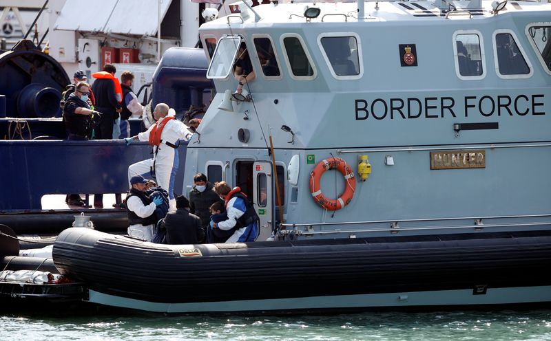 &copy; Reuters. Migrants are seen in the Border Force&apos;s boat after arriving at Dover harbour, in Dover