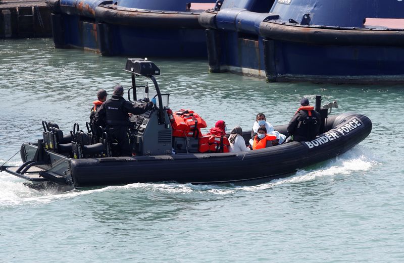 © Reuters. Migrants are brought to Dover harbour by Border Patrol, in Dover