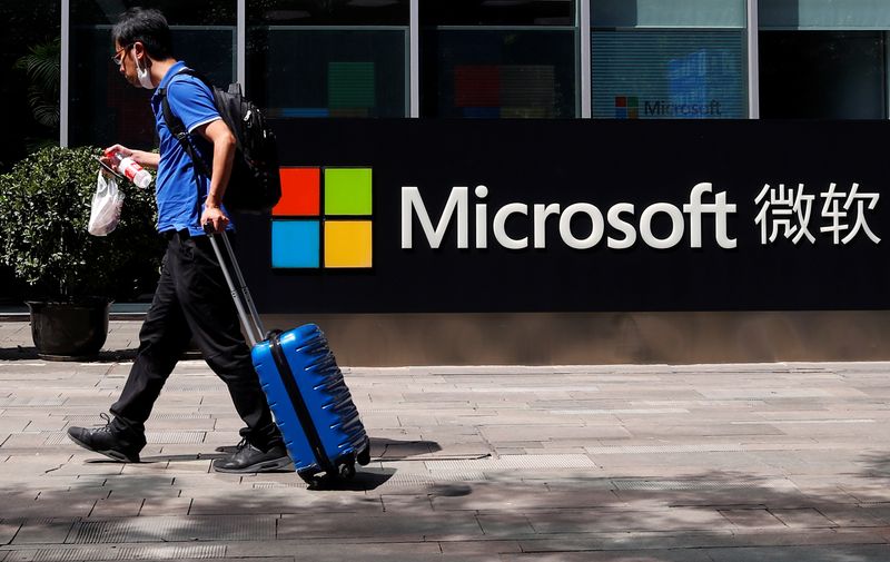 &copy; Reuters. A person walks past a Microsoft logo at the Microsoft office in Beijing