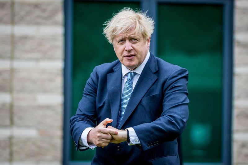 © Reuters. Britain's PM Johnson and Home Secretary Patel visit police in Northallerton