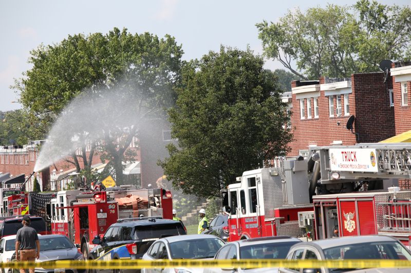 &copy; Reuters. Fire trucks are seen at the scene of an explosion in a residential area of Baltimore