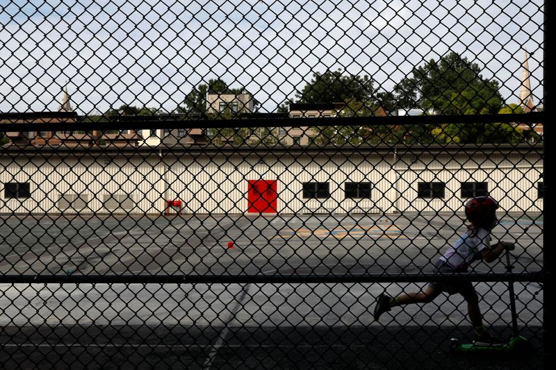 &copy; Reuters. FILE PHOTO: A child plays in the yard at New York Public School 321 in the Park Slope neighbourhood in Brooklyn, New York
