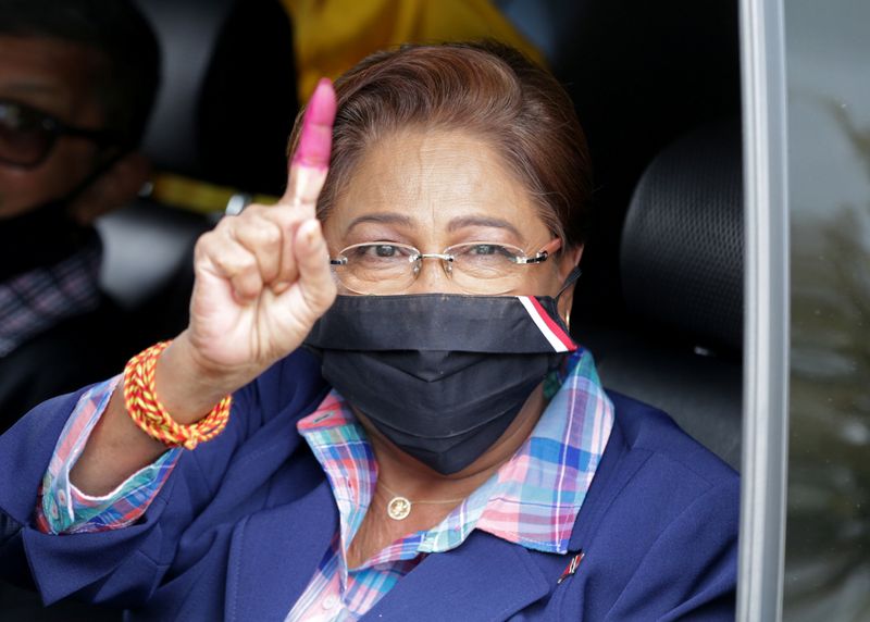 © Reuters. Trinidad and Tobago's former PM Persad-Bissessa from the opposition UNC gestures after casting her vote in a general election in Port of Spain