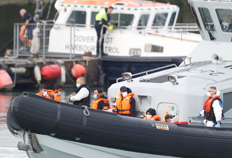 &copy; Reuters. A Border Force boat carrying migrants arrives at Dover harbour, in Dover