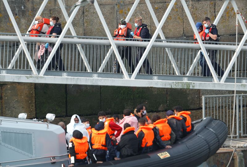 © Reuters. Migrants disembark after arriving at Dover harbour, in Dover