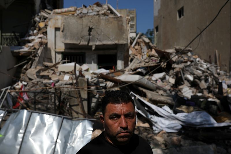 &copy; Reuters. Syrian refugee Ahmed Staifi poses for a picture in front of the house were his wife and two of his daughters were killed following a massive explosion