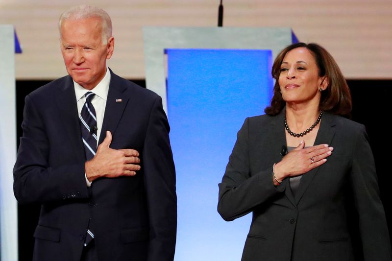 © Reuters. FILE PHOTO: Former Vice President  Biden and Senator Harris take the stage in Detroit