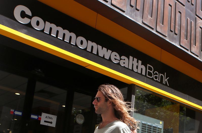 &copy; Reuters. A man walks past a branch of the Commonwealth Bank of Australia in central Sydney