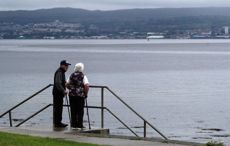 &copy; Reuters. A couple look out to the Firth of Clyde near Helensburgh, Scotland