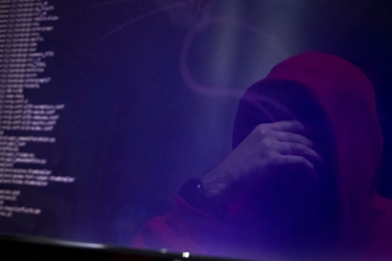 &copy; Reuters. FILE PHOTO: A man is reflected in a monitor as he takes part in a training session at Cybergym, a cyber-warfare training facility backed by the Israel Electric Corporation, at their training center in Hadera