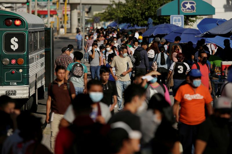 &copy; Reuters. Job seekers congregate to apply for jobs at assembly factories as the coronavirus disease (COVID-19)  outbreak continues in Ciudad Juarez