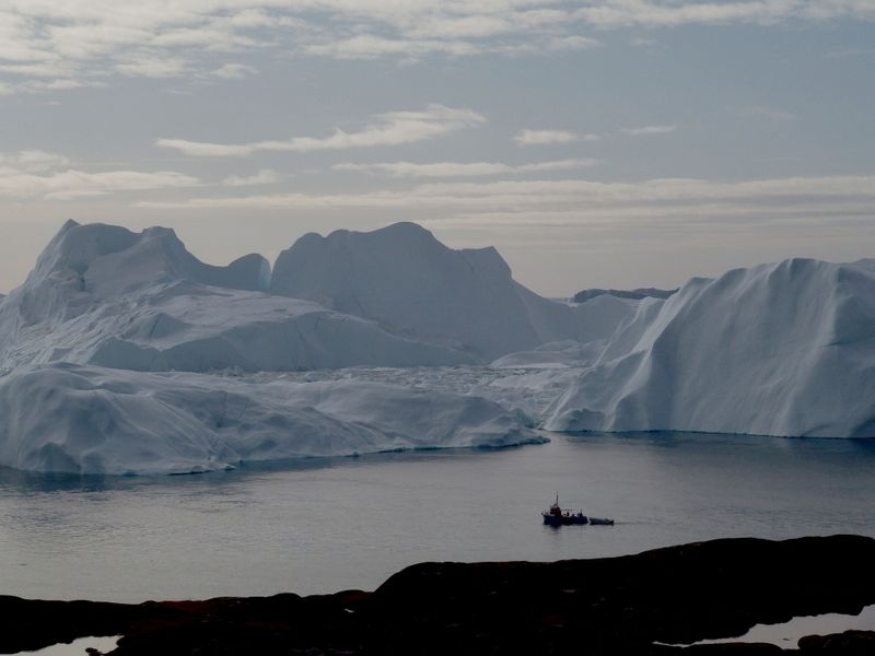 &copy; Reuters. FILE PHOTO: A fishing vessel sails in the ice fjord near Ilulissat