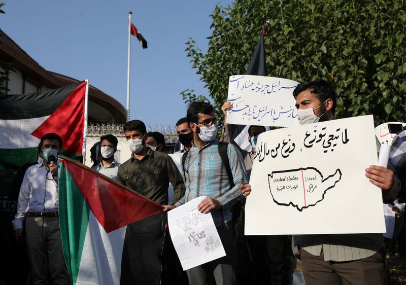 © Reuters. Students gather in front of the UAE Embassy to protest the normalization of relations with Israel, in Tehran