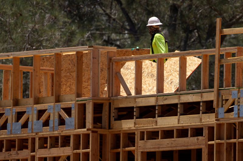 © Reuters. FILE PHOTO: A construction worker on the job at a residential project during the outbreak of the coronavirus disease in California