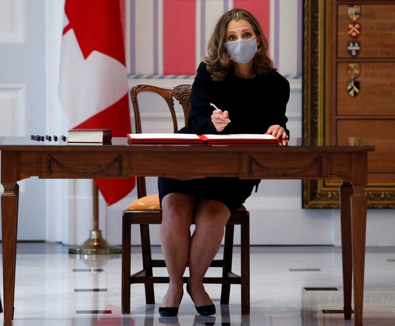 © Reuters. Deputy PM Freeland signs a book at Rideau Hall after she is sworn in as finance minister in Ottawa