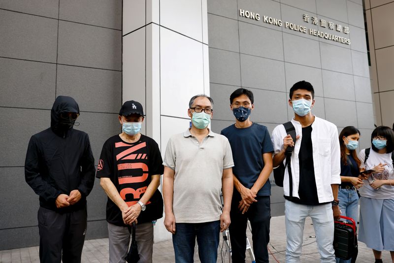 © Reuters. Relatives of 12 activists detained at sea report to the police to seek help in Hong Kong