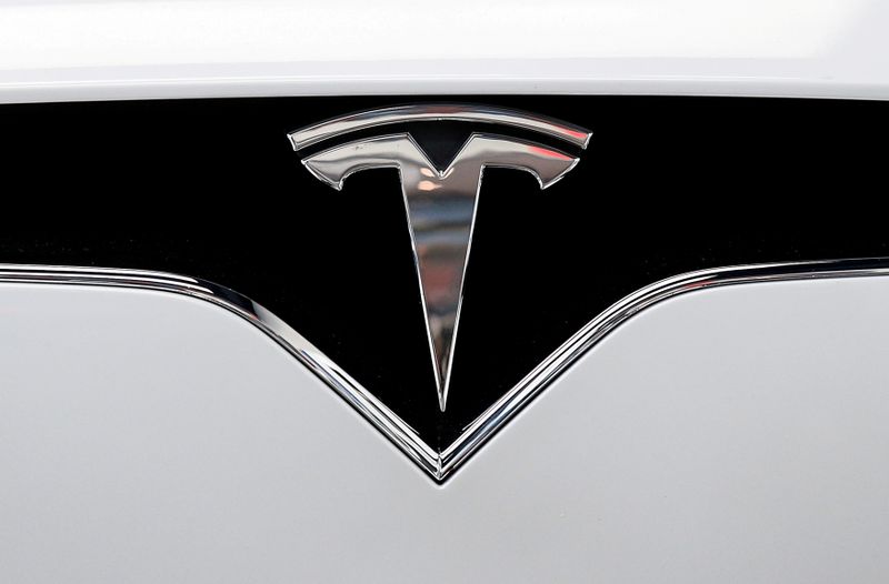 &copy; Reuters. FILE PHOTO: FILE PHOTO: FILE PHOTO: The Tesla logo is seen on a car at Tesla&apos;s showroom in Manhattan&apos;s Meatpacking District in New York