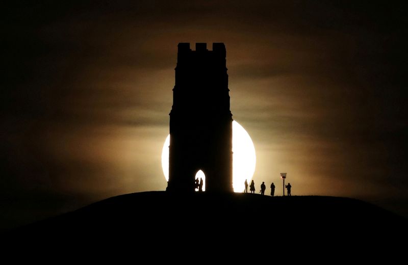 &copy; Reuters. FILE PHOTO: St Michael&apos;s Tower is seen on Glastonbury Tor as a full moon rises in Glastonbury