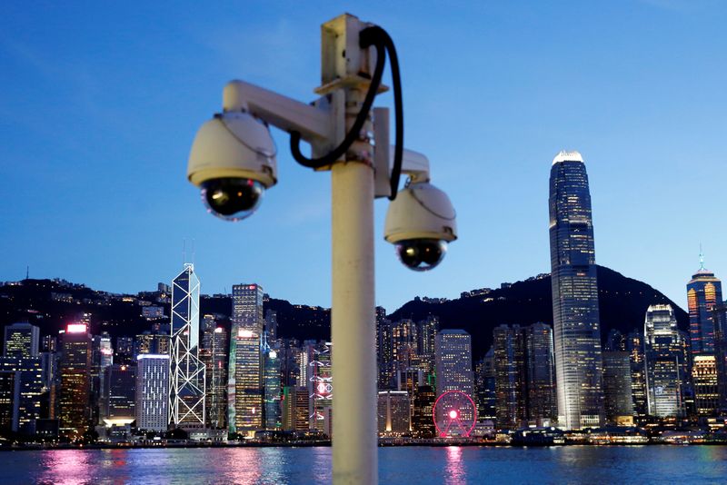 &copy; Reuters. FILE PHOTO: Pair of surveillance cameras are seen along the Tsim Sha Tsui waterfront as skyline buildings stand across Victoria Harbor in Hong Kong