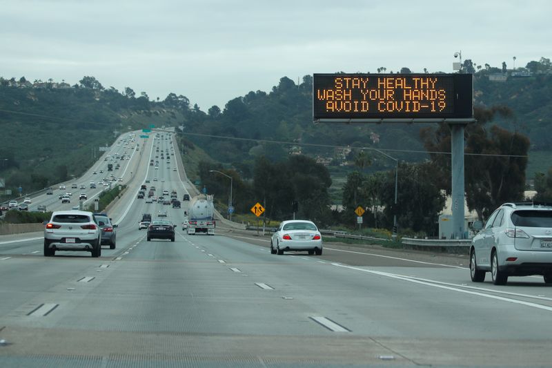 &copy; Reuters. A traffic highway sign on a usually busy interstate 5 freeway informs drivers to wash their hands due to the global outbreak of the coronavirus disease (COVID-19), in La Jolla