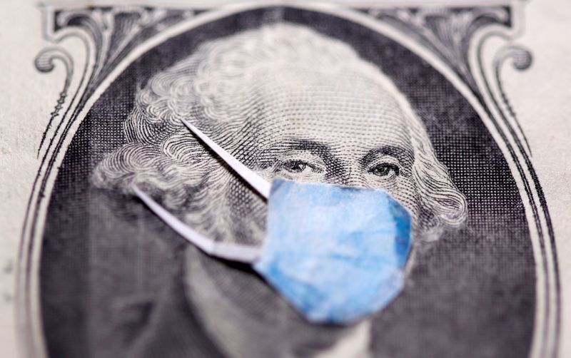 &copy; Reuters. FILE PHOTO: George Washington is seen with printed medical mask on the one dollar banknote in this illustration taken