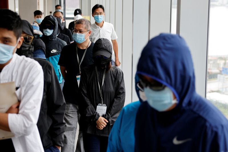 &copy; Reuters. FILE PHOTO: Mrs Wong, wife of Wong Wai Yin, one of the twelve Hong Kong detained activists, apprehended as they reportedly sailed to Taiwan for political asylum, arrives to attend a news conference in Hong Kong