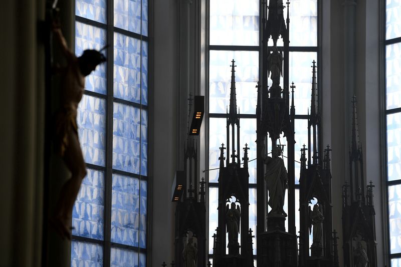 © Reuters. FILE PHOTO: Glass windows based on x-ray photographs of human lungs are seen at the Church of The Holy Cross