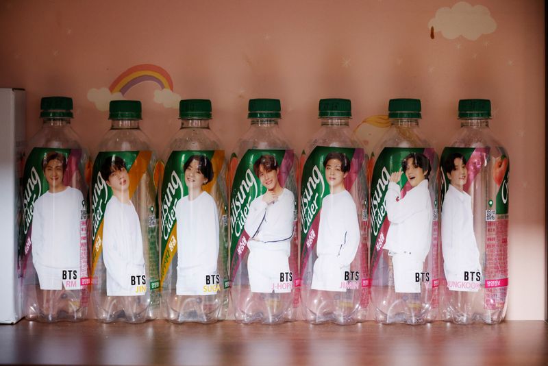 &copy; Reuters. Empty soda bottles depicting members of BTS are placed on display at fan&apos;s room in Seoul