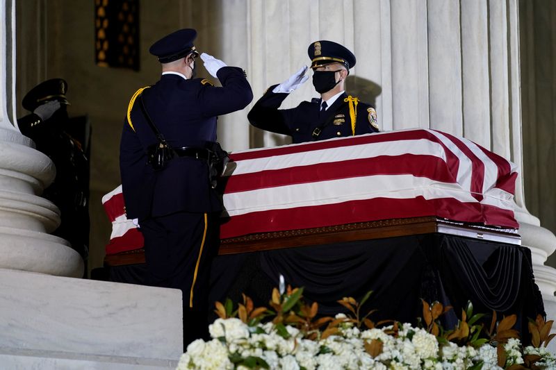 &copy; Reuters. Supreme Court Honor Guard moves the flag-draped casket of Justice Ginsburg back into the U.S. Supreme Court building in Washington