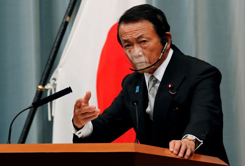 © Reuters. FILE PHOTO: Japan's newly-appointed Finance Minister Taro Aso speaks at a news conference in Tokyo