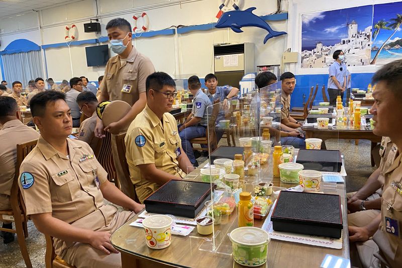 &copy; Reuters. Taiwan navy sailors sit with partitions on the dining tables, part of coronavirus  (COVID-19) pandemic prevention measures, before Taiwan&apos;s President Tsai Ing-wen arrives for lunch with them, at the Zuoying naval base in Kaohsiung, Taiwan