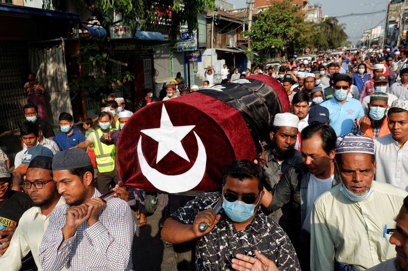 &copy; Reuters. People attend the funeral of a woman who was shot dead during an anti-coup demonstration in Mandalay