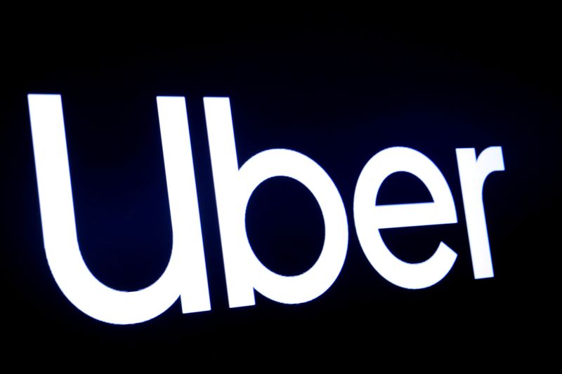 &copy; Reuters. FILE PHOTO: FILE PHOTO: A screen displays the company logo for Uber Technologies Inc in 2019
