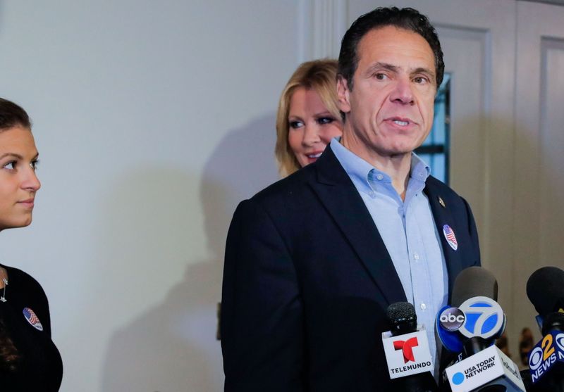 &copy; Reuters. Democratic New York Governor Andrew Cuomo gives a news conference after voting in the midterm elections, standing with his daughter, Cara Kennedy Cuomo and girlfriend Sandra Lee