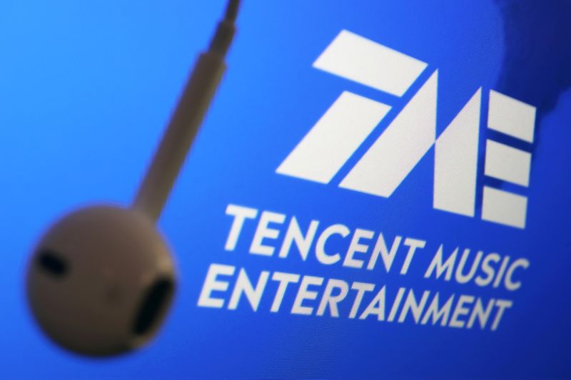 &copy; Reuters. FILE PHOTO: The logo of China's Tencent Music Entertainment Group is seen next to an earphone in this illustration picture taken March 22, 2021. REUTERS/Florence Lo/Illustration  