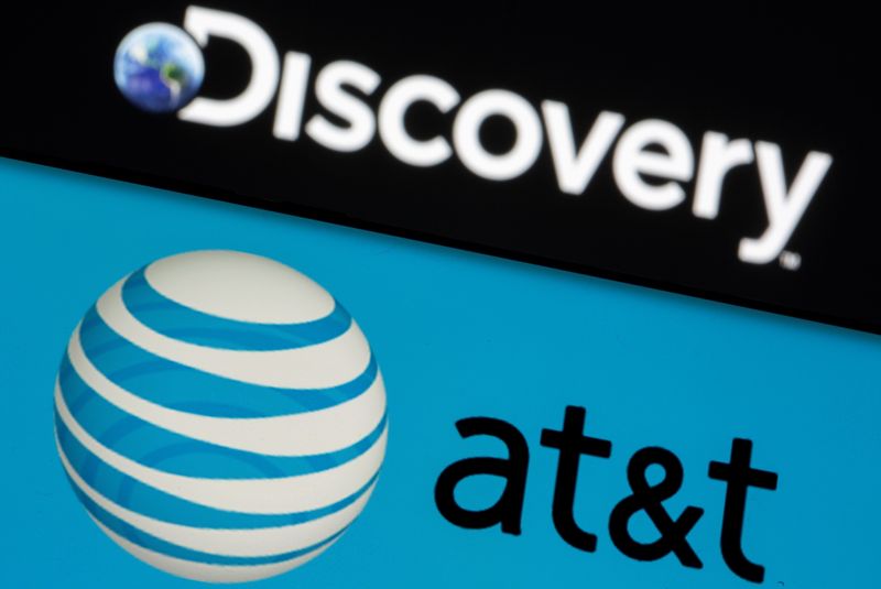 © Reuters. AT&T logo is seen on a smartphone in front of displayed Discovery logo in this illustration taken May 17, 2021. REUTERS/Dado Ruvic